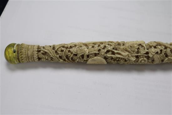 A Chinese ivory carved card case and two parasol handles